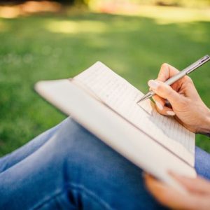 Woman nature journaling