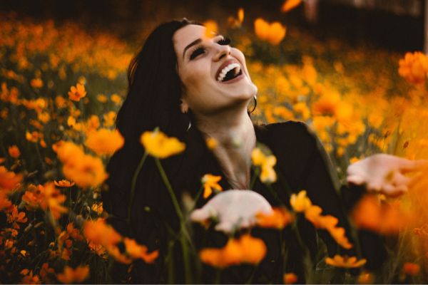 happy woman in among flowers