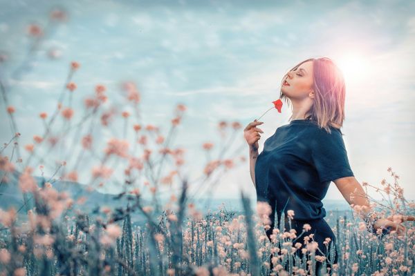 Happy woman in a field of flowers